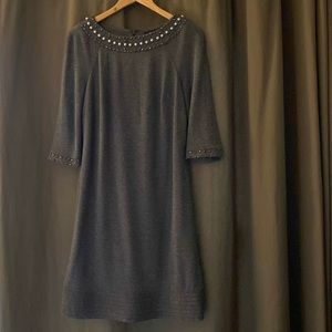 Grey, tunic style dress with accent beading around neck & 3/4 length sleeves.